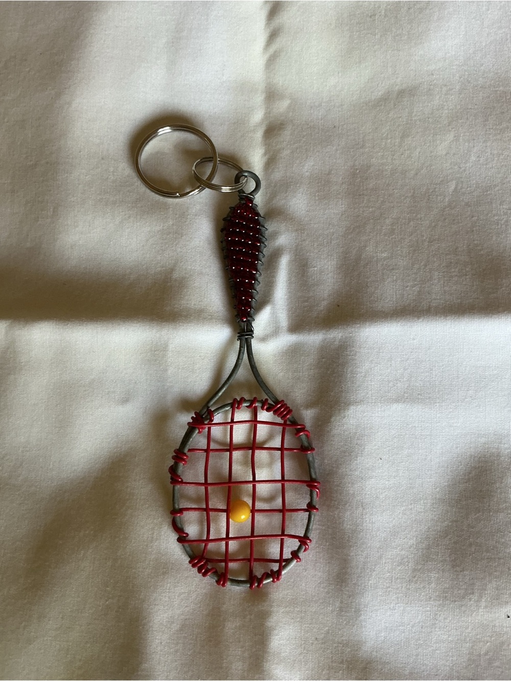 Red Wire Tennis Racket Keychain with yellow ball vintage